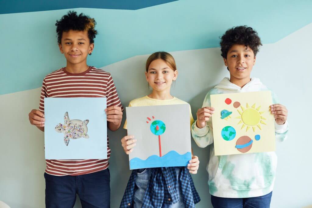 Children showing paintings
